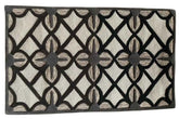 Modern geometric wool rug with black and cream design.
